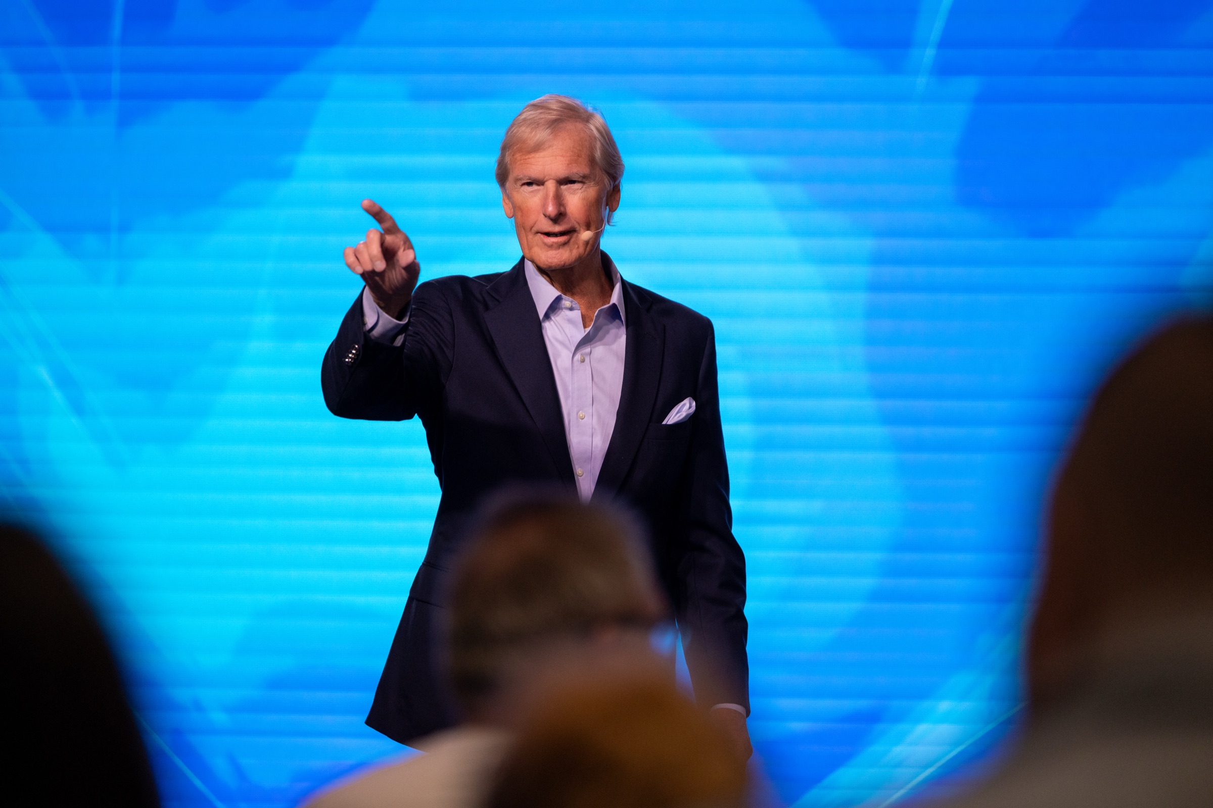 Dr Theo Wolmarans preaching from the platform at a weekend service